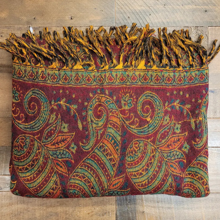 A maroon 100% acrylic woven shawl with teal paisley and fringed border ideal for summer evenings