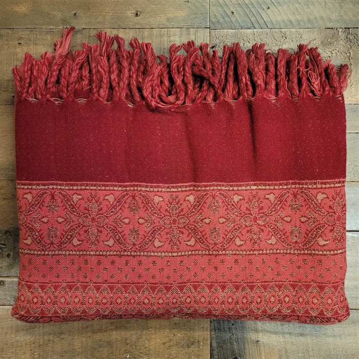 A rich red 100% acrylic multi-pattern shawl with fringed edges and geometric floral designs for summer evenings