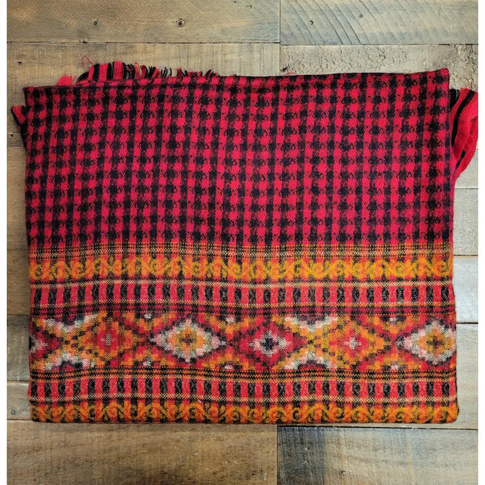 A 100% acrylic multi-pattern shawl with red and black plaid and orange tribal motifs for summer evenings use