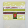 A folded 100% cotton outdoor tablecloth with lime green white burgundy brown stripes and a yellow patterned border