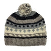 A cozy wool classic bobble hat in gray black and cream with geometric patterns and a fluffy pom-pom made from zealand wool