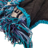 A fair trade 100% wool knitted mohican hat with a dark brown base and teal navy cream fringe made from Zealand wool