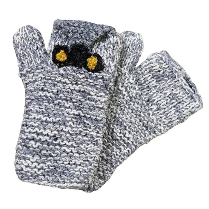 Gray and white knitted fingerless handwarmer gloves with black and yellow owl design cat eyes made of 100% wool fair trade