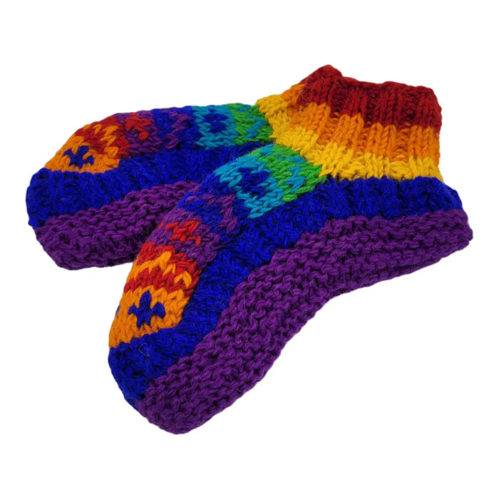 Hand knitted chunky knit socks with rainbow stripes and blue stars made from fair trade zealand wool