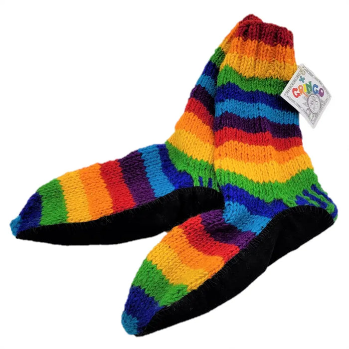 Adult wool rainbow slipper socks with rubber soles and gonggo tag in rainbow stripes made from zealand wool