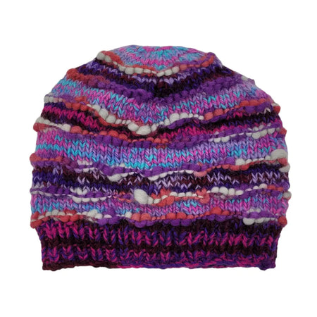 A colorful wool slouch beanie hat with purple pink blue and white wavy stripes and a ribbed brim made from zealand wool