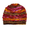 A hand-knitted wool slouch beanie hat with red orange pink and brown stripes and a ribbed texture made from zealand wool