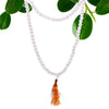 Clear quartz mala necklace with 108 rock crystal beads and an orange tassel pendant shown with a velvet pouch