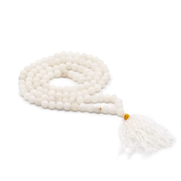 White quartz bead mala necklace with 108 smooth round beads gold accent and white tassel shown with velvet pouch