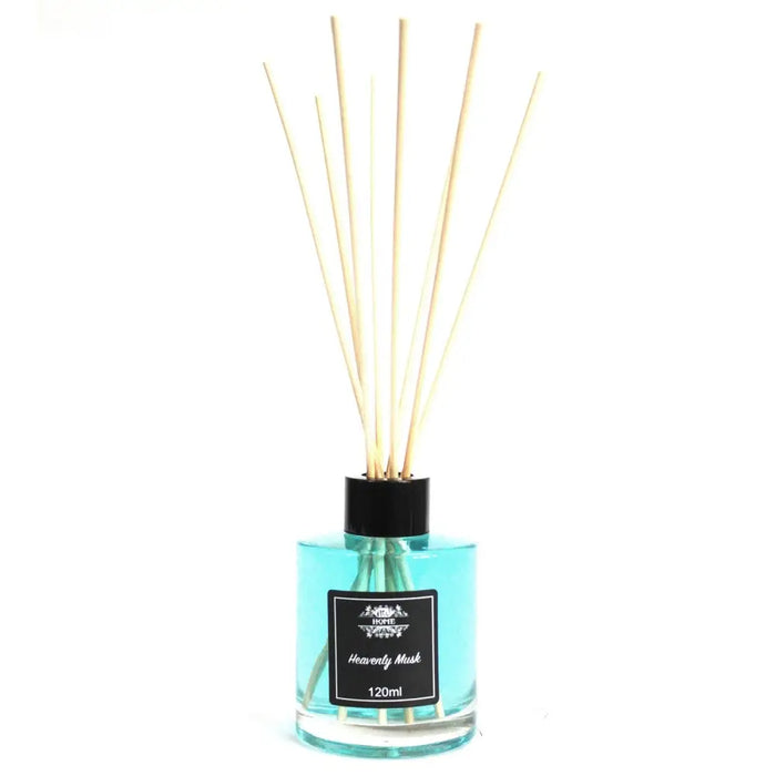 A glass bottle reed diffuser with turquoise heavenly musk liquid black cap and light wooden reeds in 120ml size