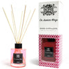Pink glass reed diffuser with black cap and wooden reeds in a clear bottle labeled 120ml reed diffuser on jasmine wings