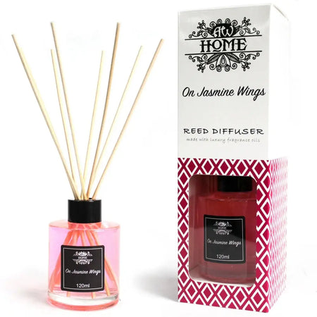 Pink glass reed diffuser with black cap and wooden reeds in a clear bottle labeled 120ml reed diffuser on jasmine wings
