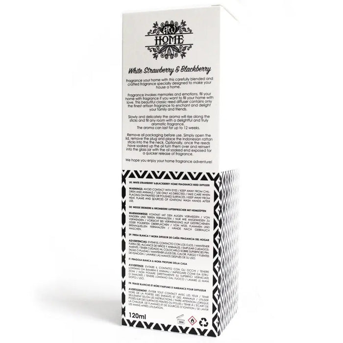 White strawberry and blackberry reed diffuser in a glass bottle with a white and black patterned box packaging