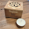 A white tea light candle in a gold tin with a brown box labeled organic goodness madurai jasmine from india organic scented tealights six fragrances