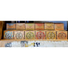 A row of india organic incense boxes with colorful geometric cutouts for 12x organic scented tealights six fragrances