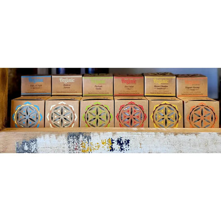 A row of india organic incense boxes with colorful geometric cutouts for 12x organic scented tealights six fragrances