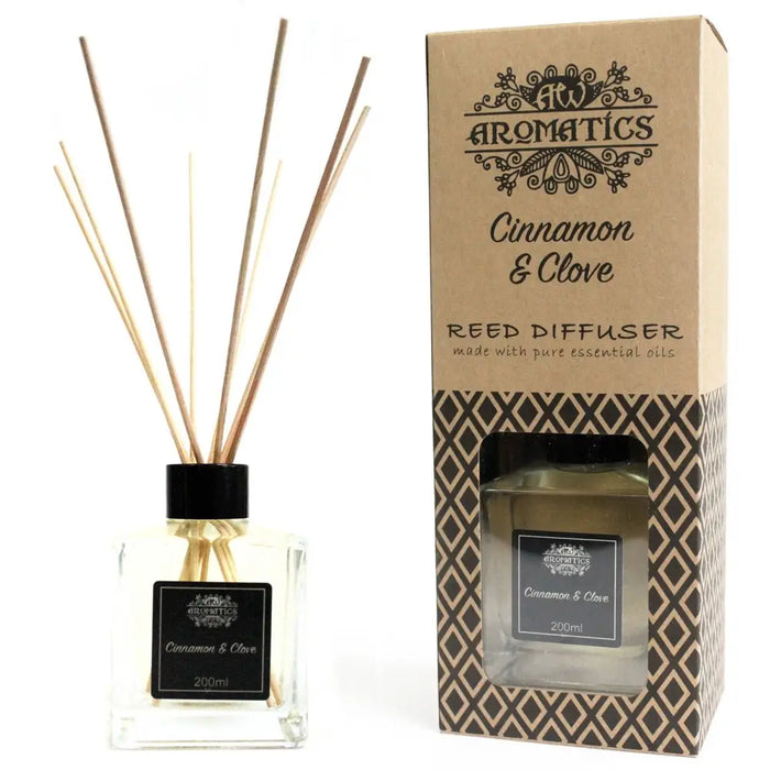 200ml cinnamon and clove essential oil reed diffuser in clear glass with black cap and natural rattan sticks
