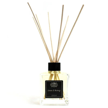 Clear glass 200ml lemon and nutmeg essential oil reed diffuser with black cap and rattan sticks filled with spicy nutmeg oil