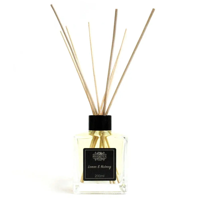 Clear glass 200ml lemon and nutmeg essential oil reed diffuser with black cap and rattan sticks filled with spicy nutmeg oil