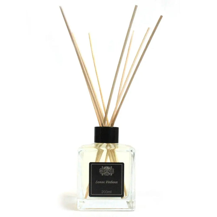 Clear glass reed diffuser with black cap and light wooden reeds featuring lemon verbena essential oil eco-mineral oil base