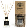 Clear glass reed diffuser with black cap and rattan sticks using frankincense essential oil and eco-mineral oil base