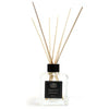 Clear glass reed diffuser with black cap and light wooden rattan sticks with peppermint frankincense essential oil