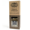 A brown cardboard box with a floral rosewood essential oil reed diffuser and clear glass bottle with rattan sticks