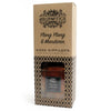 A brown glass reed diffuser bottle with mandarin essential oil and ylang ylang in a geometric patterned box by aromatics