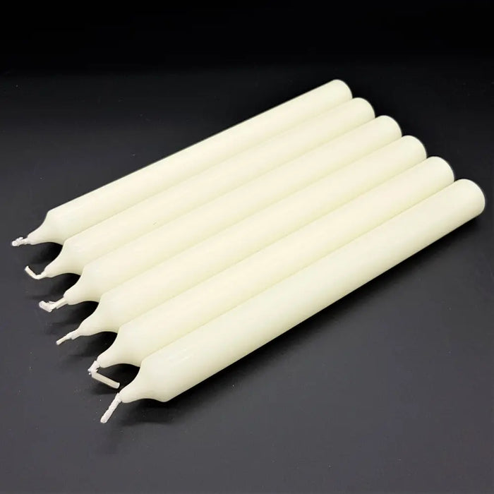 Six off-white 21cm non-drip bistro dinner candles with smooth cylindrical bodies and pointed tips sold individually
