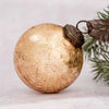 A 3 inch large champagne crackle glass bauble with vintage gold mercury glass, dark metal cap, and attached ribbon