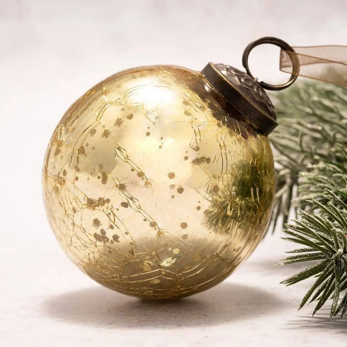 A vintage-style 3 inch large gold crackle glass christmas tree bauble with a dark metal cap and loop