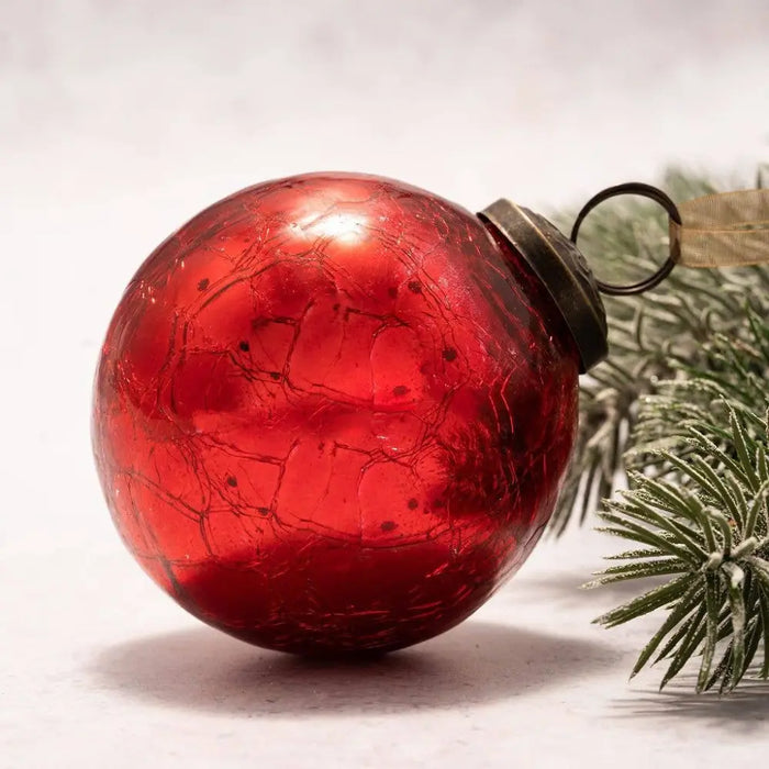 A vibrant red 3 inch large crackle glass christmas bauble with a textured surface and metallic cap