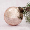 A 3 inch large rose quartz crackle glass christmas bauble with a dark metal cap and loop for hanging