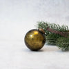 A 3 inch olive green crackle glass christmas bauble with a vintage gold mercury glass finish and brass cap