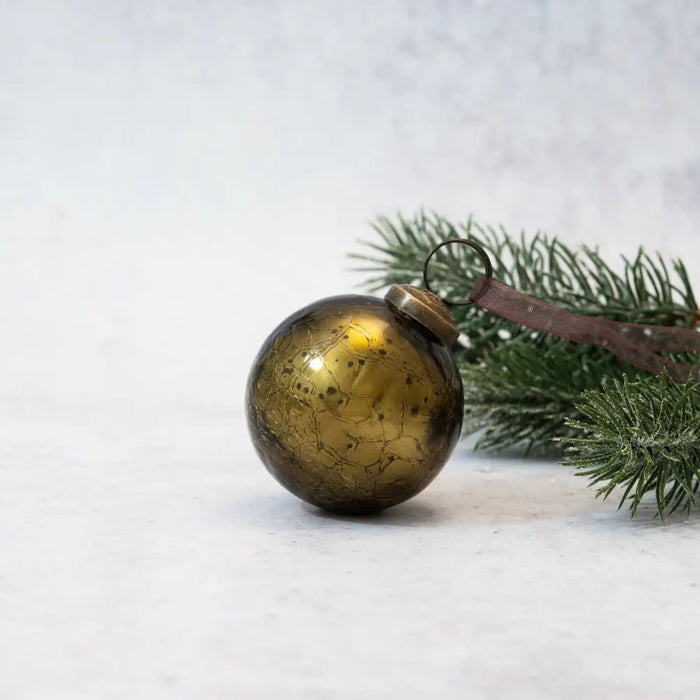 A 3 inch olive green crackle glass christmas bauble with a vintage gold mercury glass finish and brass cap