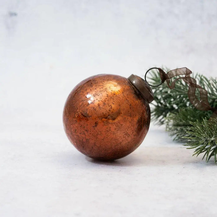 A 3 inch russet crackle glass christmas bauble with copper color and a vintage crackled finish with metallic cap