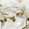 A 3 inch spray botanical bauble with slender brown dried flowers encased in clear resin