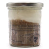 Cocktail body sugar scrub in a clear glass jar with silver lid showing layers of brown sugar and white shea butter