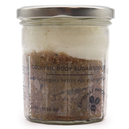 Cocktail body sugar scrub in a clear glass jar with silver lid showing layers of brown sugar and white shea butter