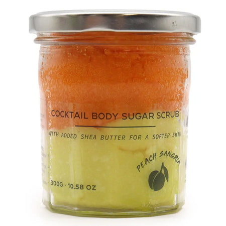 Peach sangria sugar body scrub with shea butter in a clear glass jar with silver lid for moisturizing skin care