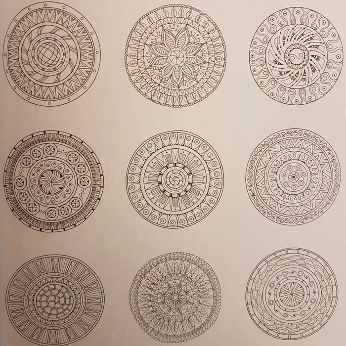 An adult colouring book page with nine black and white mandala designs on light paper for zen colouring