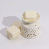 Cream ceramic wax melt burner with floral cutouts and a matching wax cube from agnes and cat fragrance gift set moroccan