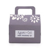 A purple cardboard fragrance gift set box with white floral pattern and handle labeled agnes cat home fragrance set