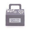 Gray cat wellness gift box with white floral cutout and handle labeled agnes cat lake breeze wellness gift set