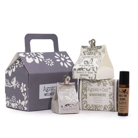 Gray house-shaped gift box with white floral and bird patterns and handle for agnes & cat wellness gift lake breeze