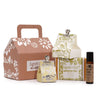 A brown paper wellness gift set box with white floral and bird patterns and a handle for cat wellness by agnes & cat