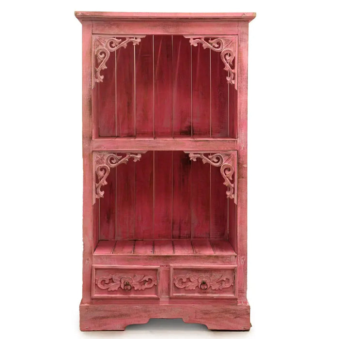 A rustic pink wooden albasia bathroom cabinet with ornate carved corners and two drawers at the base