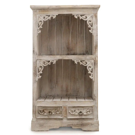 A rustic whitewashed albasia bathroom cabinet with carved corner brackets and floral carved drawers