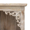 A distressed white wooden corbel with intricate scrollwork on an albasia bathroom cabinet whitewash bathroom cabinet