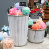 Pastel bath bombs in a large albesia wood storage tub with whitewash finish and rope trim